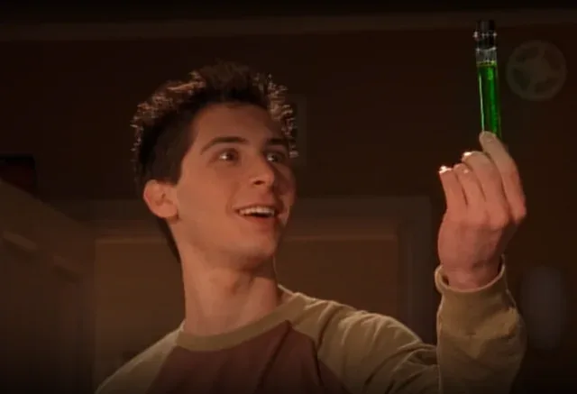 Reese proudly holding up his green Blellow experiment